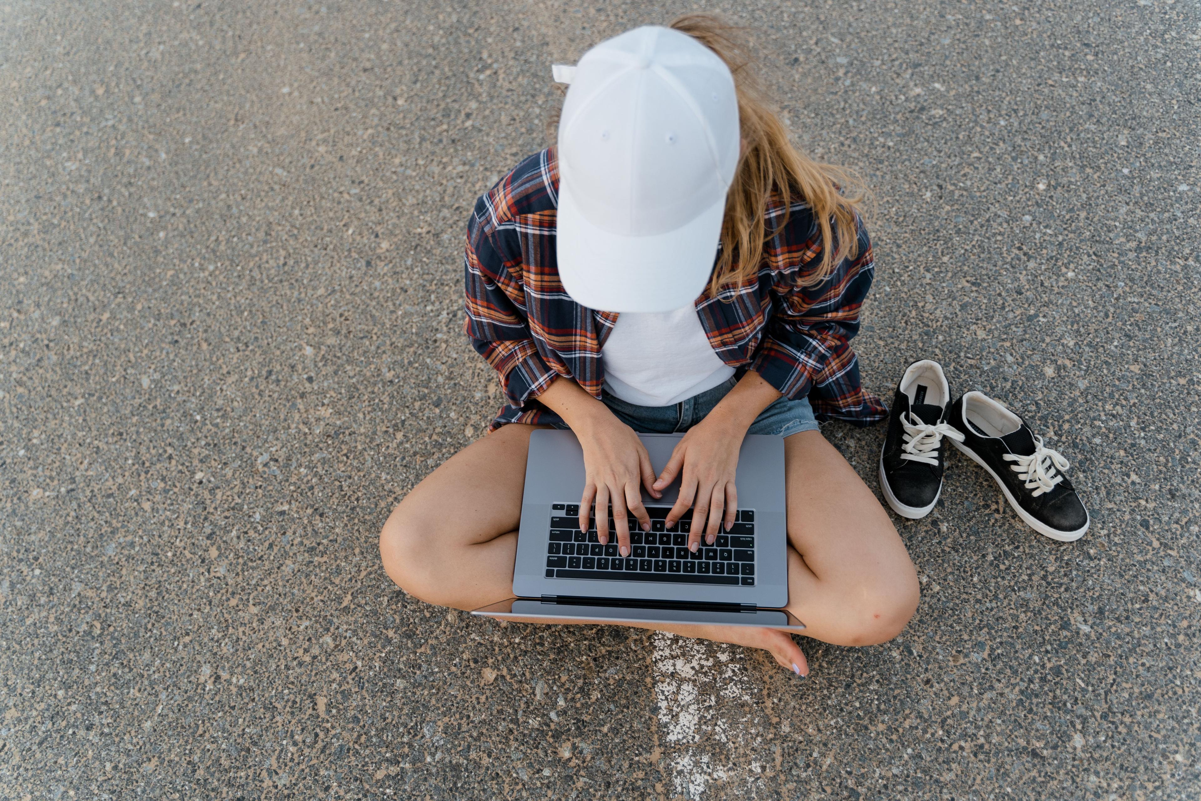 A remote entrepreneur working on a laptop, representing a US LLC owner who documents consistent income to meet the UAE visa's bank statement requirement.
